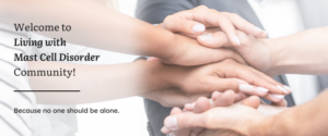 A welcome banner for Living With Mast Cell community featuring a group of hands symbolizing unity